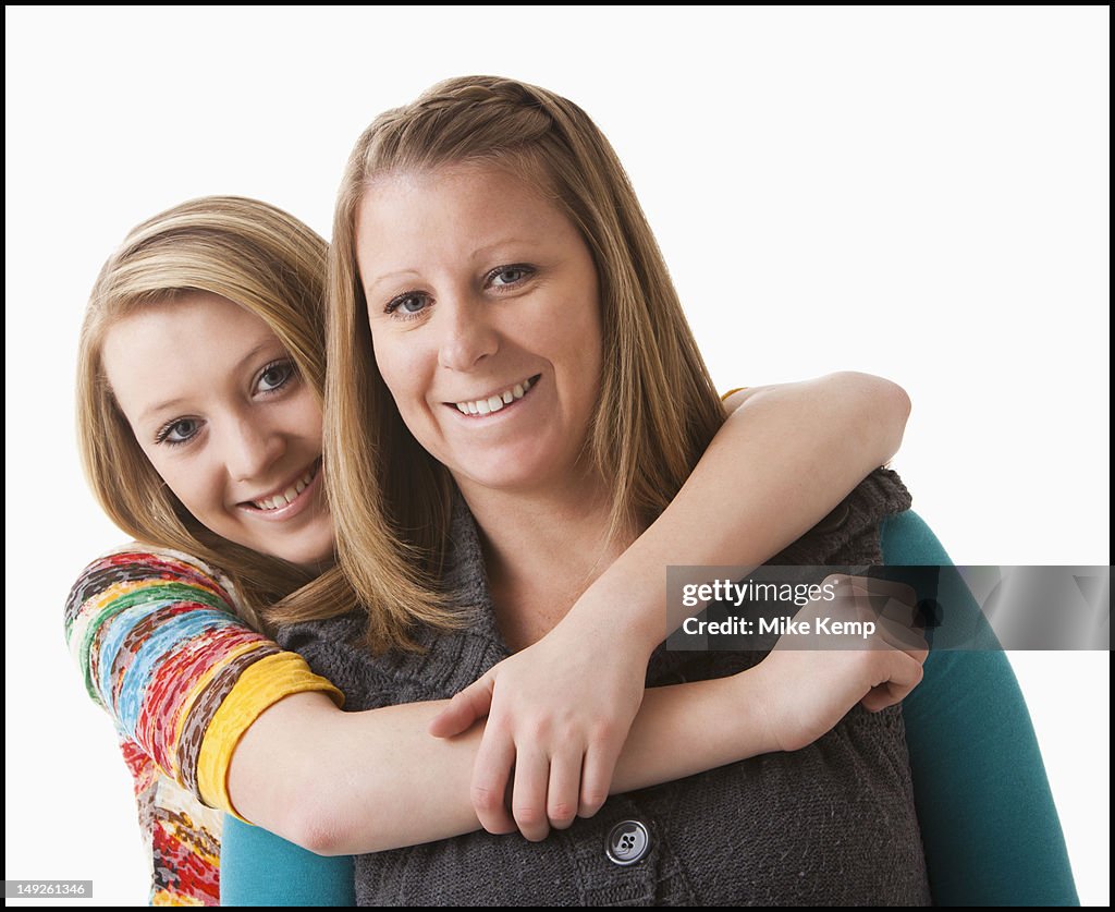 Studio shot of girl (12-13) with mother