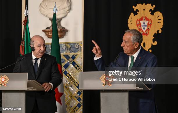 Algeria's President Abdelmadjid Tebboune and Portuguese President Marcelo Rebelo de Sousa deliver remarks during a joint press conference in Belem...