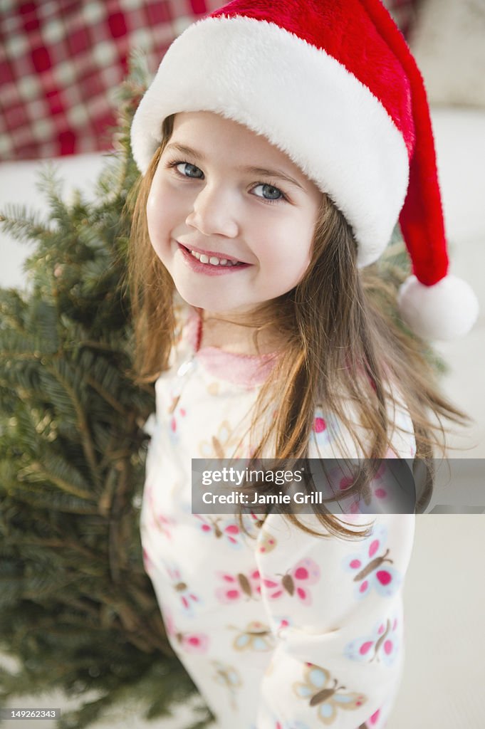 USA, New Jersey, Jersey City, Portrait of small girl (4-5 years) in Santa hat