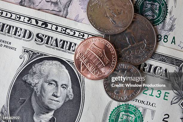 close-up of dollar banknotes and coins - 米国硬貨 ストックフォ��トと画像