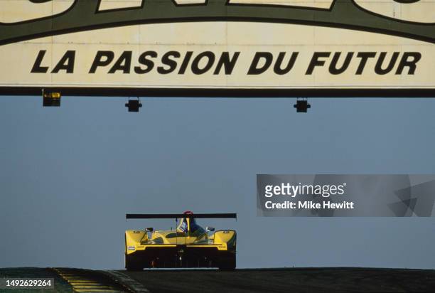 The Welter Racing WR LMP675 Peugeot Turbo I4 driven by Stéphane Daoudi,Jean-Bernard Bouvet and Xavier Pompidou from France pass under the Dunlop...