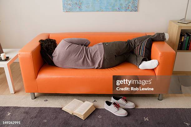 usa, california, los angeles, man sleeping on sofa - lazy day fotografías e imágenes de stock