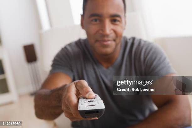 Man Remote Control 617 Black Man Remote Control Stock Photos, High-Res Pictures, and ...