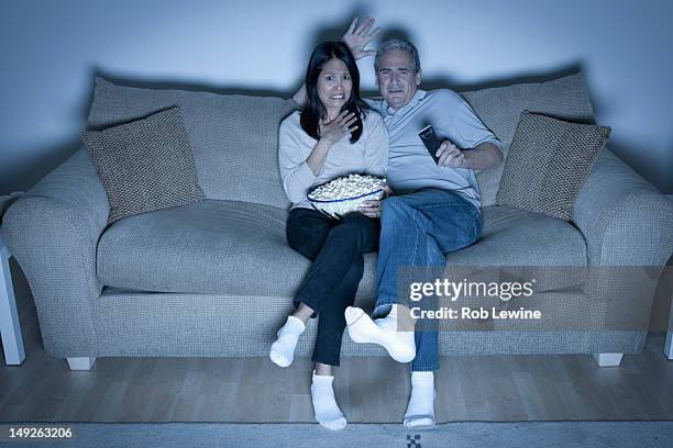 usa, california, los angeles, couple watching television - watching tv couple night stock pictures, royalty-free photos & images