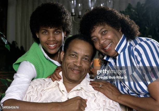 Basketball standout Cheryl Miller with parents Saul and Carrie Miller inside the family home, June 11, 1985 in Riverside, California.