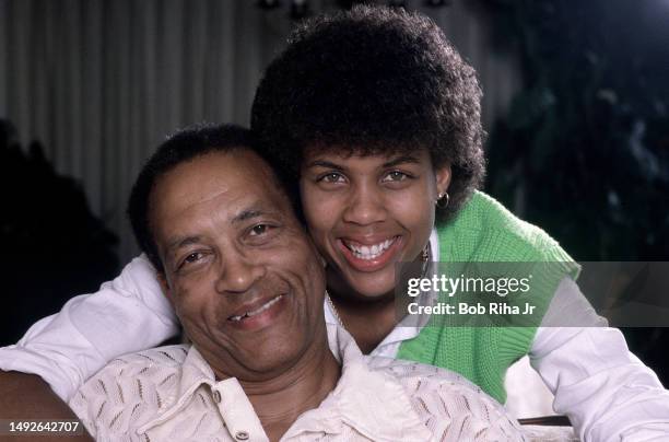 Basketball standout Cheryl Miller with her father Saul Miller inside the family home, June 11, 1985 in Riverside, California.