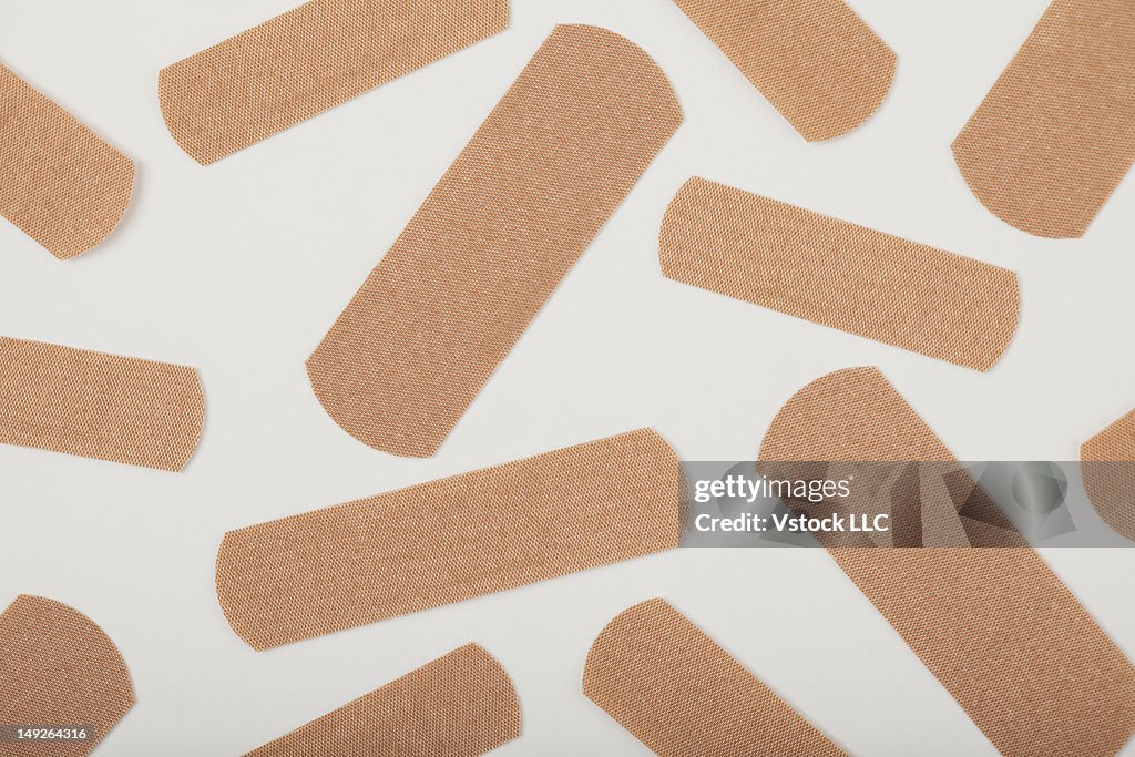 Adhesive bandages on white background