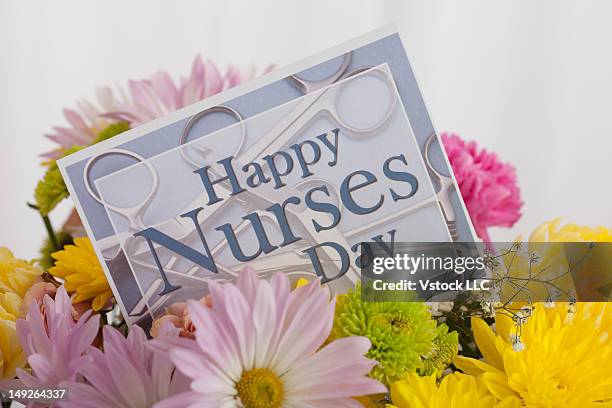 flowers with greeting card for mother's day, studio shot - international nurses day stock pictures, royalty-free photos & images