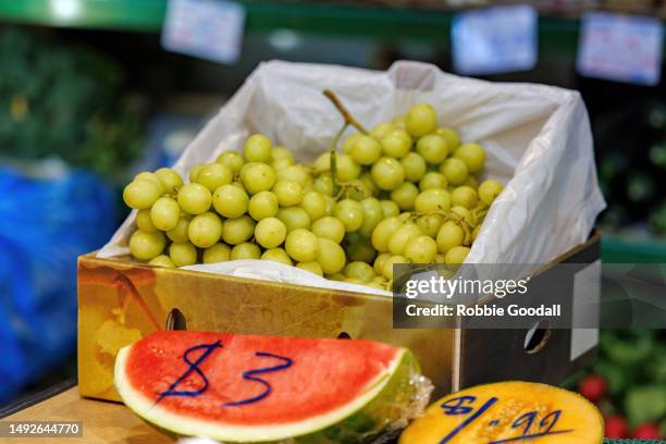 seedless grapes, watermelon and rockmelon on display at a market stall - fremantle stock pictures, royalty-free photos & images