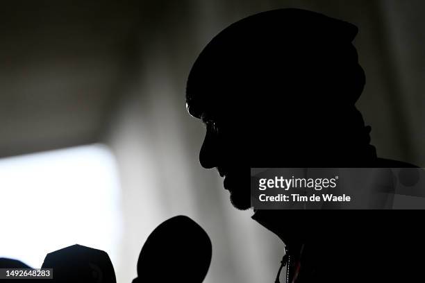 Silhouet of João Almeida of Portugal and UAE Team Emirates - White best young jersey and stage winner attends to the media press after cross the...
