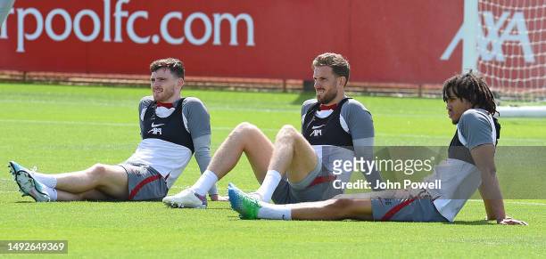 Andy Robertson, Jordan Henderson and Trent Alexander-Arnold of Liverpool during a training session at AXA Training Centre on May 23, 2023 in Kirkby,...