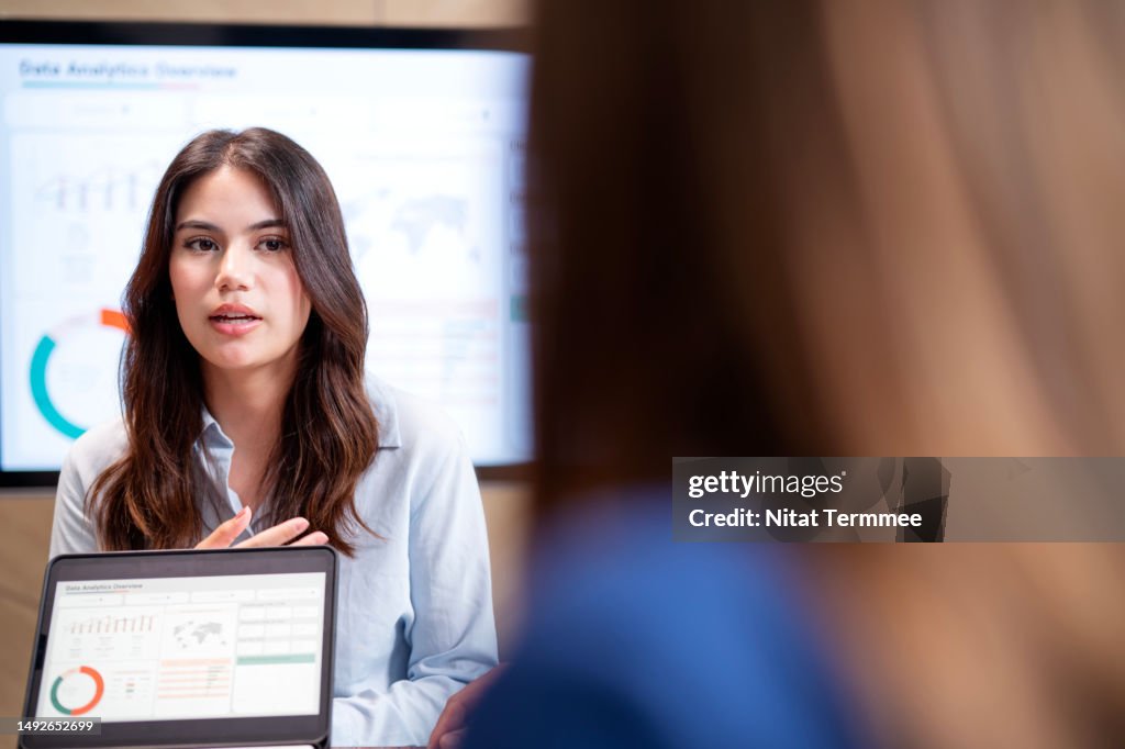 Take Good Notes, Request Updates, and Follow-up in a Project Meeting Perfection Can Help Control Risk Factors. A young project leader in a project follow-up meeting to conduct a risk factor and project progress in a business office.