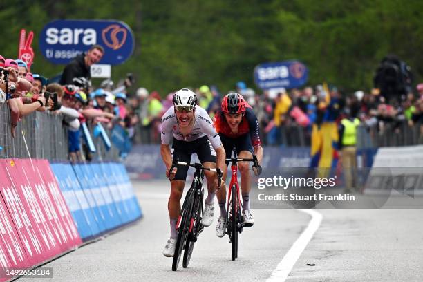 João Almeida of Portugal and UAE Team Emirates - White best young jersey and Geraint Thomas of The United Kingdom and Team INEOS Grenadiers sprint at...