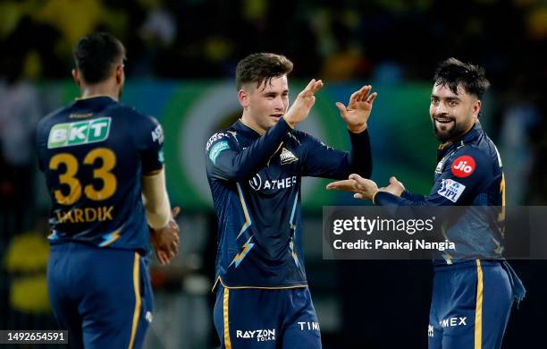 Rashid Khan of Gujarat Titans celebrates with teammates after taking the wicket of Ambati Rayudu of Chennai Super Kings during the IPL Qualifier...