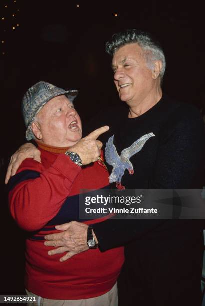 Mickey Rooney and Tony Curtis with friends and family at the Hollywood Christmas Parade, Los Angeles, California, United States, December 1994.