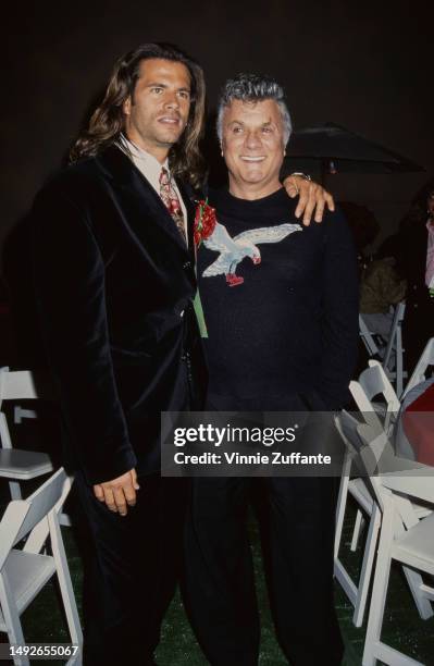 Lorenzo Lamas and Tony Curtis at the Hollywood Christmas Parade, Los Angeles, California, United States, December 1994.