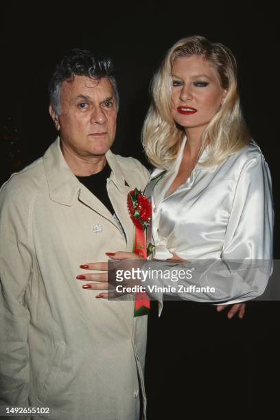 Tony Curtis with friends and family at the Hollywood Christmas Parade, Los Angeles, California, United States, December 1994.