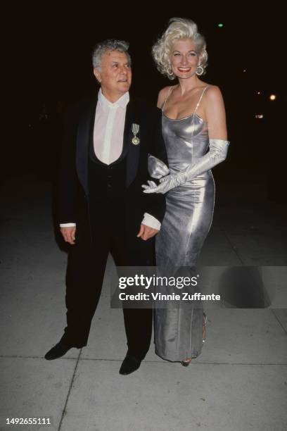 Tony Curtis and his wife during 1996 Vanity Fair Oscar Party at Morton's Restaurant in West Hollywood, California, United States, 2th March 1996.