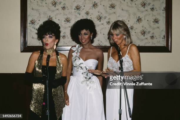 Diahann Carol, Linda Evans And Joan Collins at the Emmy Awards Show in Pasadena, California, United States, 23rd September 1984.