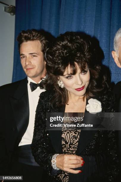 Luke Perry, Joan Collins and Aaron Spelling attend an event, United States, circa 1980s.