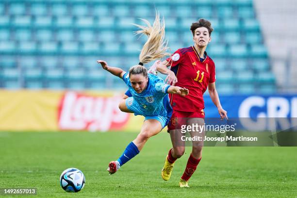 Ria Bose of England is tackled by Pau of Spain during the UEFA Women's European Under-17 Championship Semi-Final match between Spain and England at...