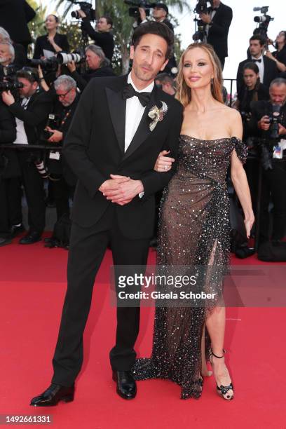 Adrien Brody and Georgina Chapman attend the "Asteroid City" red carpet during the 76th annual Cannes film festival at Palais des Festivals on May...
