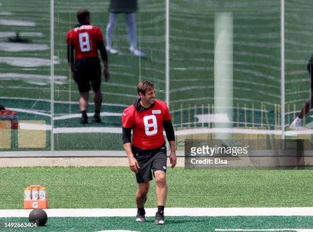 Aaron Rodgers of the New York Jets stretches after a medicine ball drill during an offseason workout session at Atlantic Health Jets Training Center...