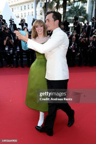 Maya Hawke and Rupert Friend attend the "Asteroid City" red carpet during the 76th annual Cannes film festival at Palais des Festivals on May 23,...