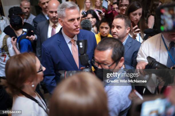 Speaker of the House Kevin McCarthy is surrounded by reporters as he makes his way to the House floor on May 23, 2023 in Washington, DC. Negotiations...