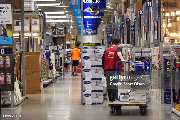 Customers shop at a Lowe's store on May 23, 2023 in Chicago, Illinois. Despite reporting a 4.3% drop in comparable sales for the quarter ending May...