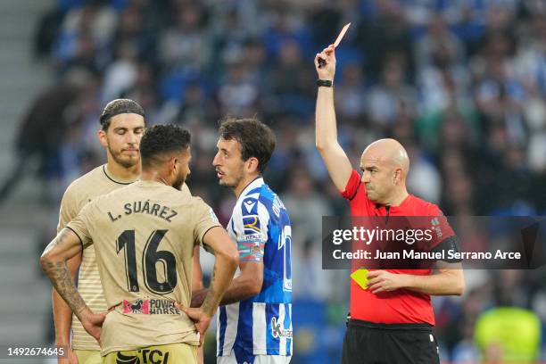 Referee Gonzalez Fuertes shows a red card to Luis Suarez of UD Almeria during the LaLiga Santander match between Real Sociedad and UD Almeria at...