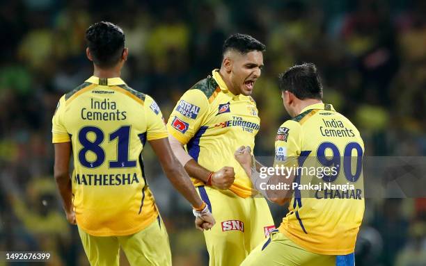 Tushar Deshpande of Chennai Super Kings celebrates with teammates after taking the wicket of Rashid Khan of Gujarat Titans during the IPL Qualifier...