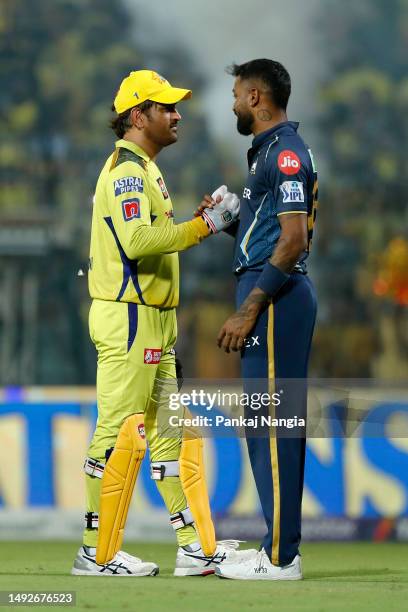 Mahendra Singh Dhoni of Chennai Super Kings shakes hands with Hardik Pandya, Captain of Gujarat Titans after the IPL Qualifier match between Gujarat...