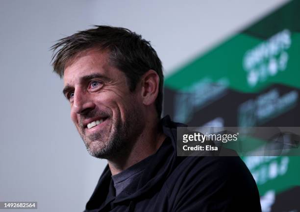 Aaron Rodgers of the New York Jets answers questions after an offseason workout session at Atlantic Health Jets Training Center on May 23, 2023 in...