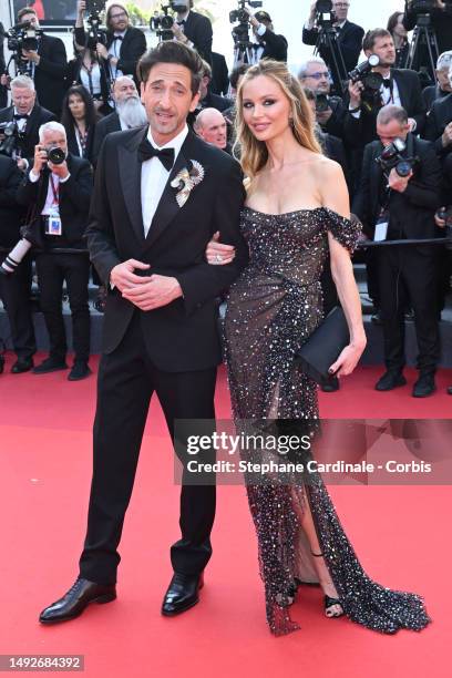 Adrien Brody and Georgina Chapman attend the "Asteroid City" red carpet during the 76th annual Cannes film festival at Palais des Festivals on May...