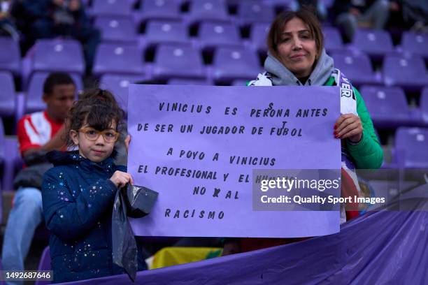 Young supporter of Real Valladolid CF with a notice supporting Vinicius Junior of Real Madrid CF during the LaLiga Santander match between Real...