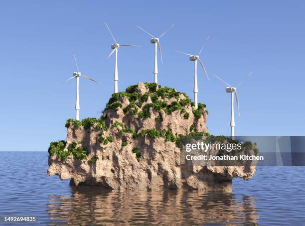 small island with wind turbines - environmental stewardship stock pictures, royalty-free photos & images