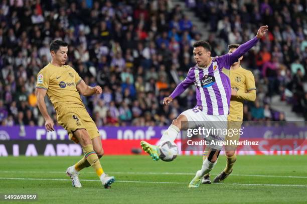 Oscar Plano of Real Valladolid CF controls the ball under pressure from Robert Lewandowski of FC Barcelona during the LaLiga Santander match between...