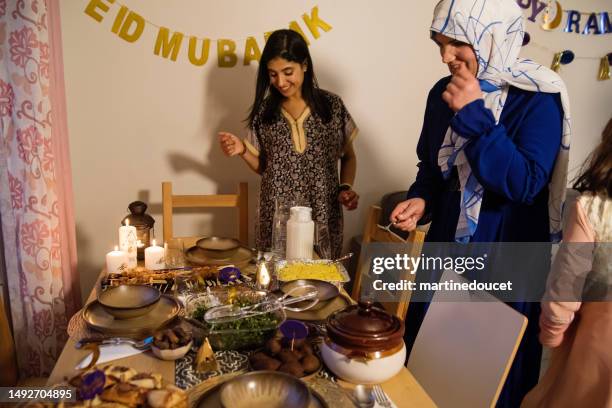 north-american muslim family ready to eat iftar at ramadan. - iftar stock pictures, royalty-free photos & images