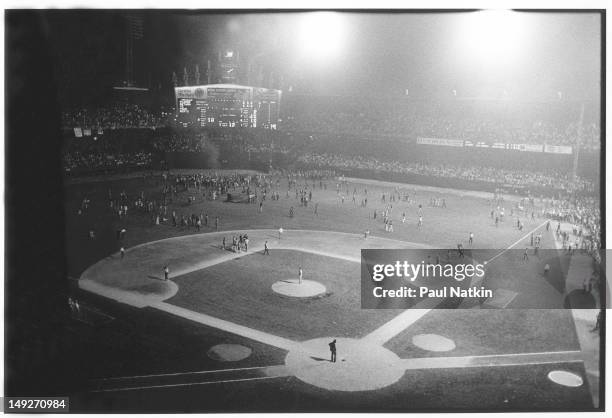 General view of the crowd as they storm the field at Comiskey Park during an anti-disco promotion, Chicago, Illinois, July 12, 1979. The event, held...