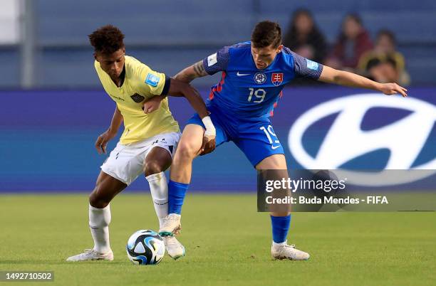 Samuel Kopasek of Slovakia and Oscar Zambrano of Ecuador battle for the ball during FIFA U-20 World Cup Argentina 2023 Group B match between Ecuador...