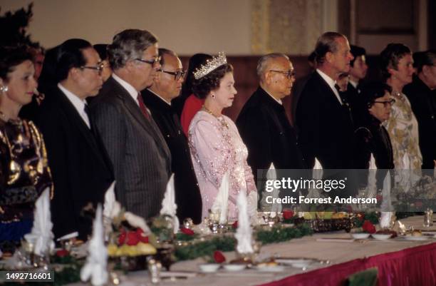 View of Chinese Premier Zhao Ziyang , British monarch Queen Elizabeth II , Chinese President Li Xiannian , and British royal Prince Philip , among...