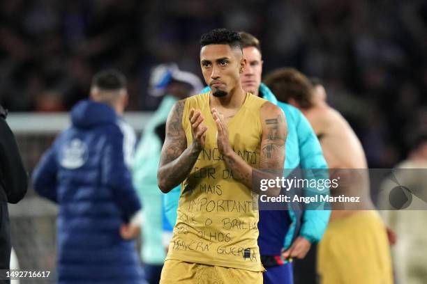 Raphinha of FC Barcelona applauds the fans wearing a top with a message in support of Vinicius Jr of Real Madrid after the LaLiga Santander match...