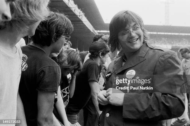 American disc jockey Steve Dahl poses with members of the crowd during an anti-disco promotion at Comiskey Park, Chicago, Illinois, July 12, 1979....