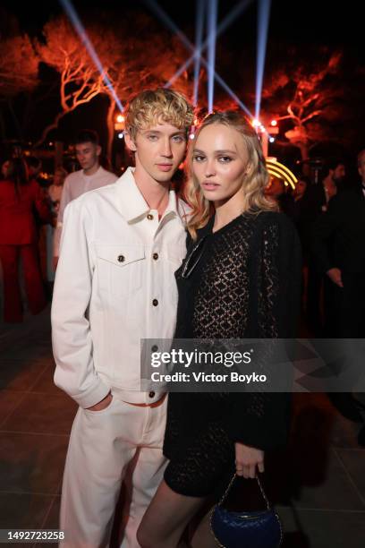 Troye Sivan and Lily-Rose Depp attend the Cannes Film Festival Air Mail Party at Hotel du Cap-Eden-Roc on May 23, 2023 in Cap d'Antibes, France.