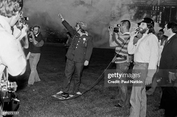 American disc jockey Steve Dahl waves to the crowd during an anti-disco promotion at Comiskey Park, Chicago, Illinois, July 12, 1979. The event,...