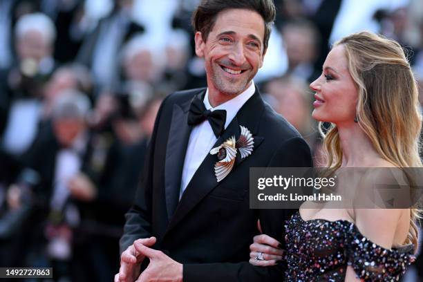 Adrien Brody and Georgina Chapman attend the "Asteroid City" red carpet during the 76th annual Cannes film festival at Palais des Festivals on May...