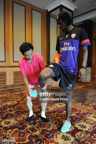 Gervinho of Arsenal FC have a demonstration of Jianzi in the St. Regis Hotel in Beijing during their pre-season Asian Tour in China on July 26 2012...