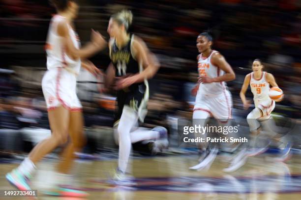 Rebecca Allen of the Connecticut Sun dribbles the ball up the court /M during the first half at Entertainment & Sports Arena on May 23, 2023 in...