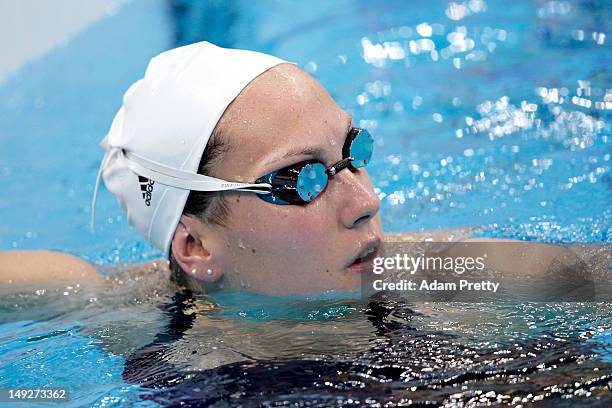 Swimmer Alexianne Castel of France looks on during a training session ahead of the London Olympic Games at the Aquatics Centre in Olympic Park on...